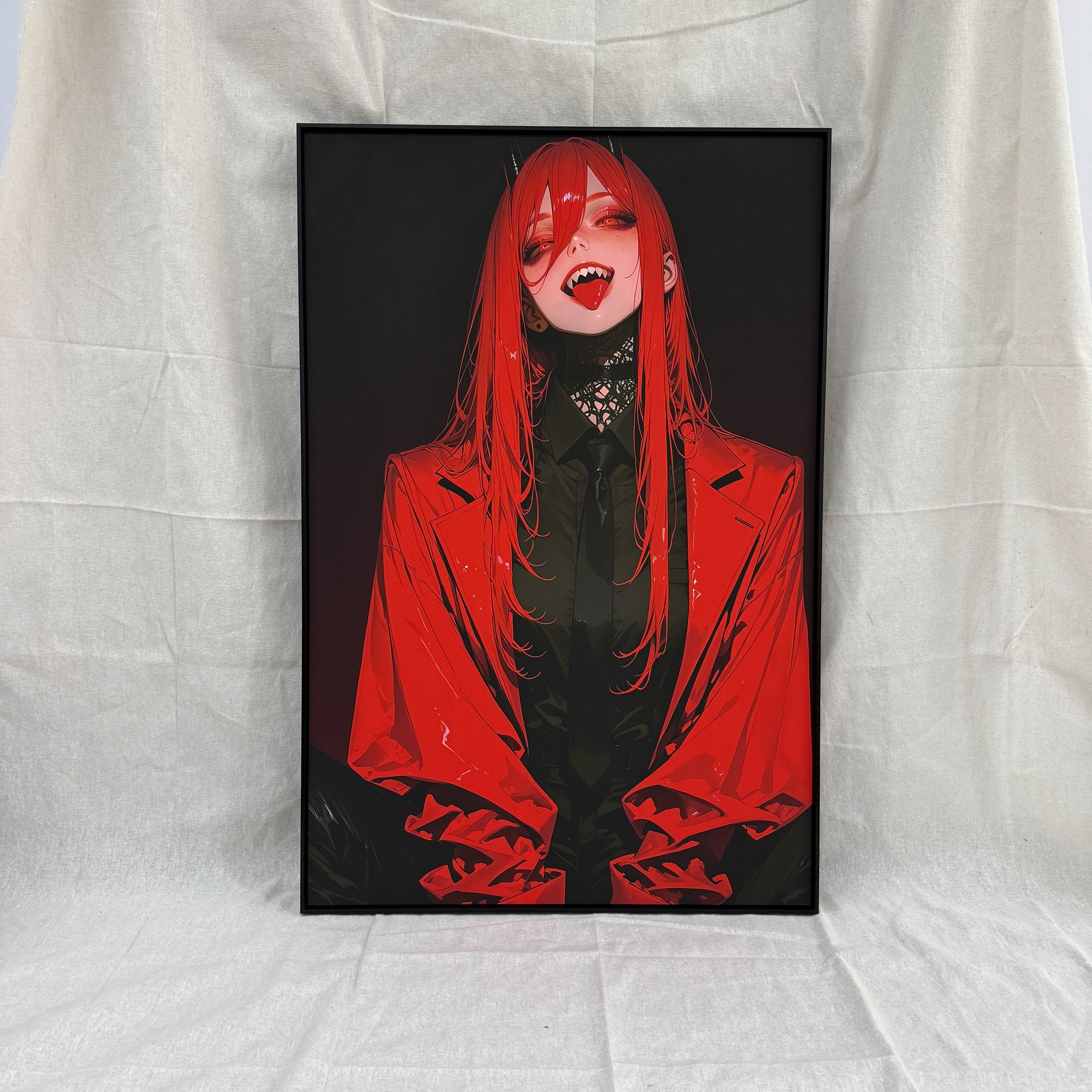 Framed artwork of a character with red hair and a red coat on a white fabric background